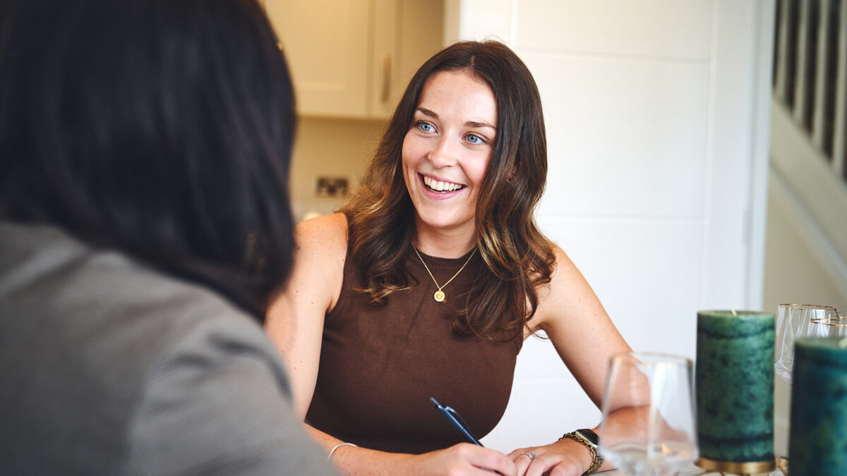 Woman writing on a notepad