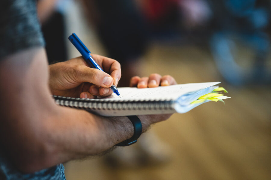 Man writing on a notepad