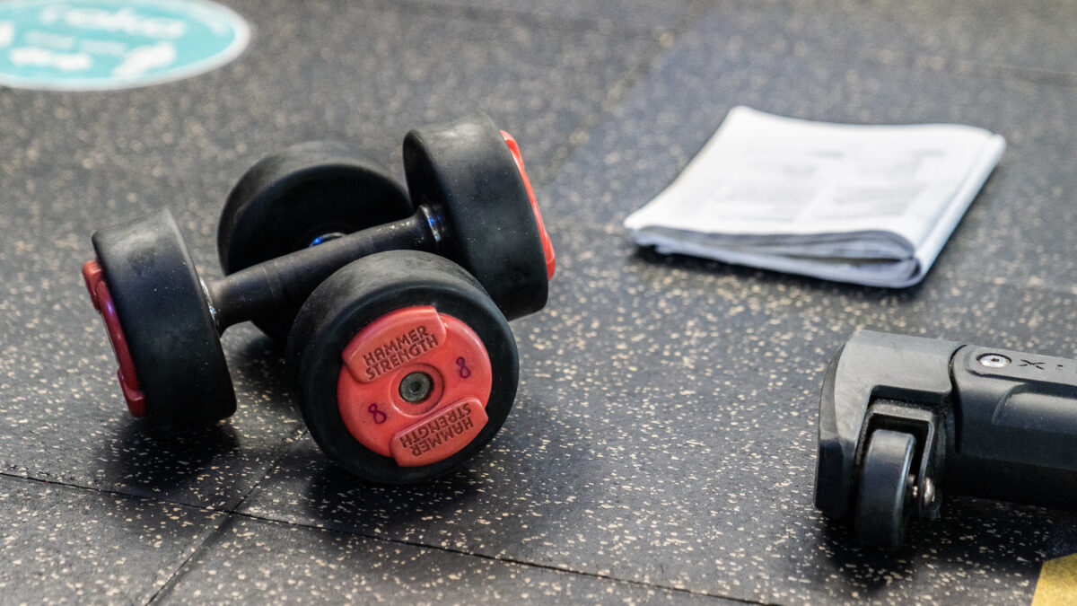 a pair of dumbbells laid on the floor